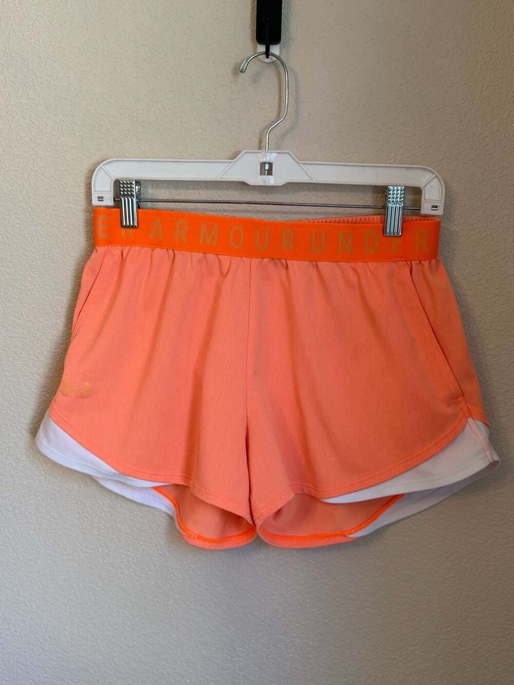 Under Armour Women's Play Up Twist 3.0 shorts  in Orange/White